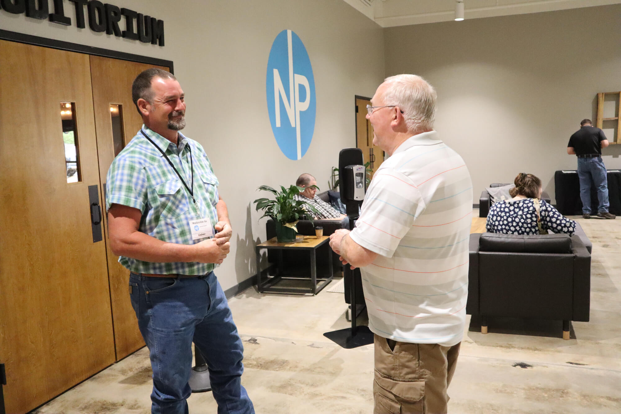 two men talking together